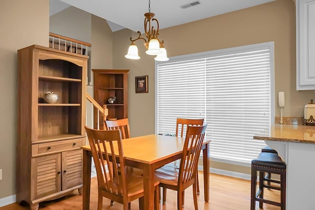 652 Spinner Cir, Mount Pleasant, SC 29464 - dining room featuring light wood finished floors and a chandelier