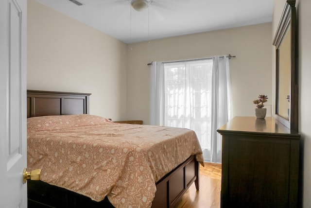 652 Spinner Cir, Mount Pleasant, SC 29464 - bedroom with light wood-style floors and a ceiling fan