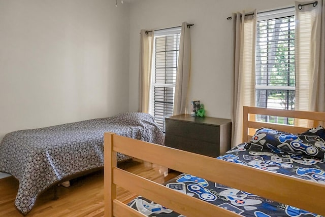 652 Spinner Cir, Mount Pleasant, SC 29464 - bedroom featuring multiple windows and wood finished floors