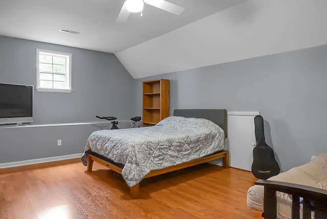 652 Spinner Cir, Mount Pleasant, SC 29464 - bedroom with wood finished floors, vaulted ceiling, and ceiling fan