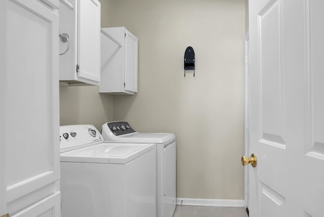 652 Spinner Cir, Mount Pleasant, SC 29464 - laundry room featuring independent washer and dryer, cabinet space, and light tile patterned floors