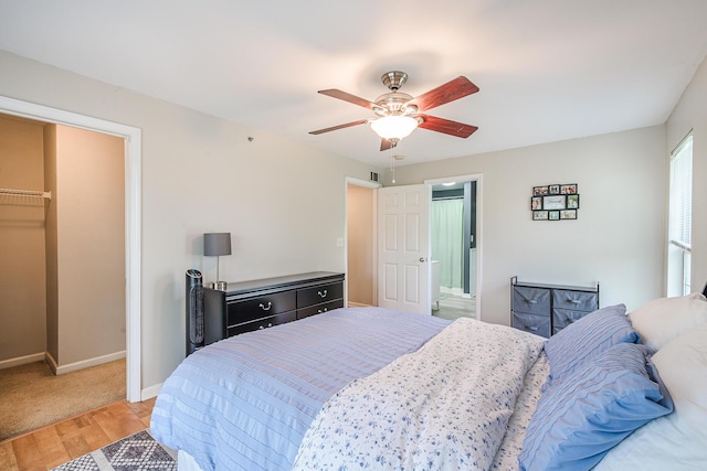 bedroom with ceiling fan and light hardwood / wood-style floors