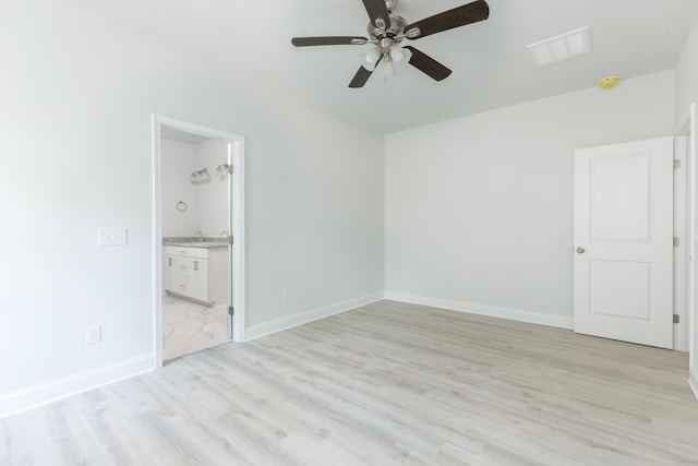 unfurnished room featuring light hardwood / wood-style flooring, ceiling fan, and sink