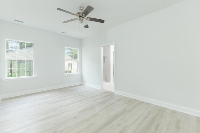 unfurnished room featuring light hardwood / wood-style flooring and ceiling fan