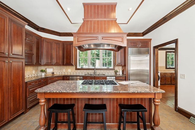 125 Drayton Dr, Summerville, SC 29483 - kitchen featuring appliances with stainless steel finishes, a sink, plenty of natural light, tasteful backsplash, and ornamental molding