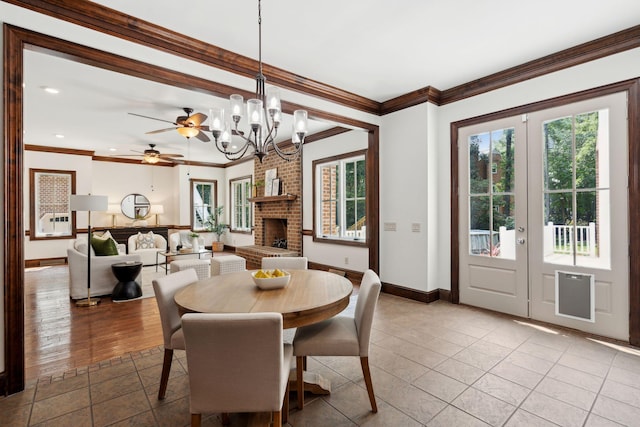 125 Drayton Dr, Summerville, SC 29483 - dining space with plenty of natural light, baseboards, crown molding, a chandelier, and french doors