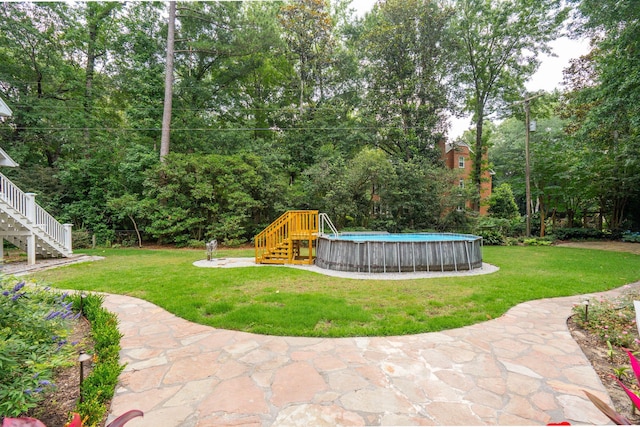 125 Drayton Dr, Summerville, SC 29483 - view of grassy yard with stairway and an outdoor pool