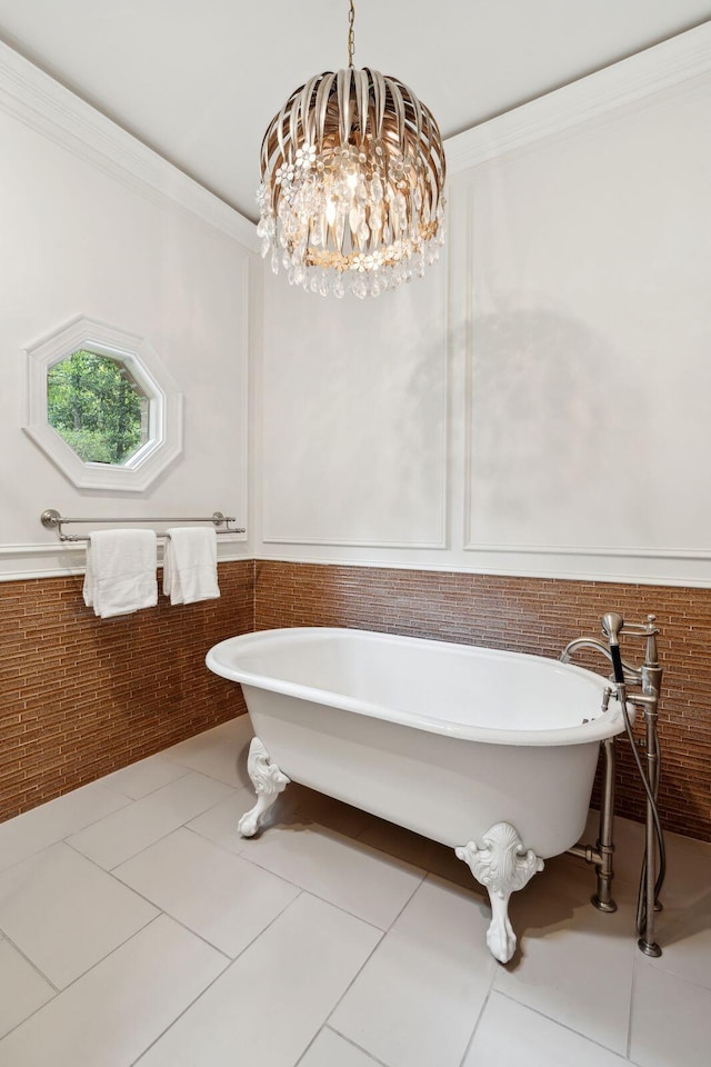 125 Drayton Dr, Summerville, SC 29483 - full bath featuring a soaking tub, tile patterned floors, wainscoting, a chandelier, and crown molding