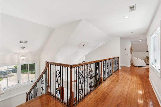 125 Drayton Dr, Summerville, SC 29483 - hall featuring vaulted ceiling, a chandelier, light wood-style flooring, an upstairs landing, and recessed lighting
