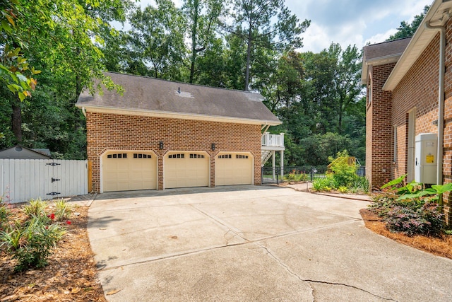 125 Drayton Dr, Summerville, SC 29483 - view of side of property with brick siding, a garage, roof with shingles, and concrete driveway