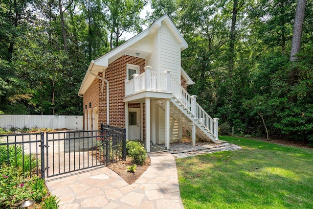 125 Drayton Dr, Summerville, SC 29483 - view of front of house featuring brick siding, a gate, and stairway