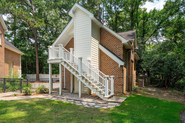 125 Drayton Dr, Summerville, SC 29483 - view of home's exterior with stairway and brick siding