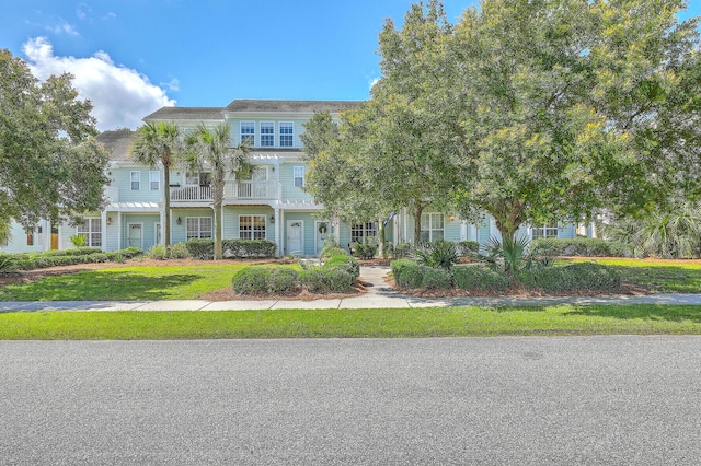 1723 Brittlebush Ln, Johns Island, SC 29455 - townhome / multi-family property featuring a balcony and a front lawn