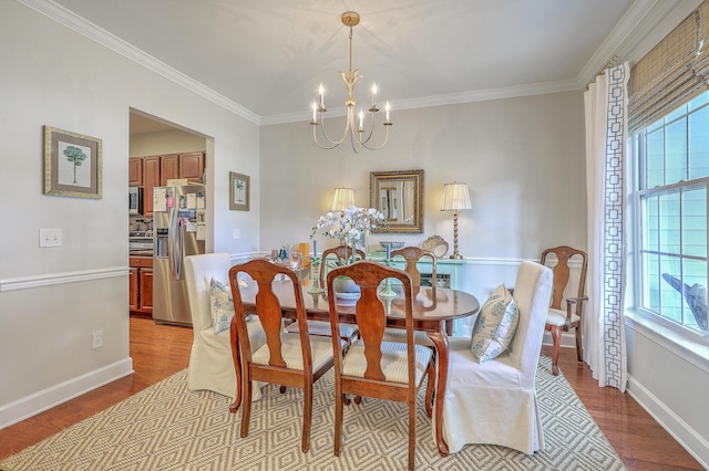 1723 Brittlebush Ln, Johns Island, SC 29455 - dining room with a chandelier, crown molding, and wood finished floors