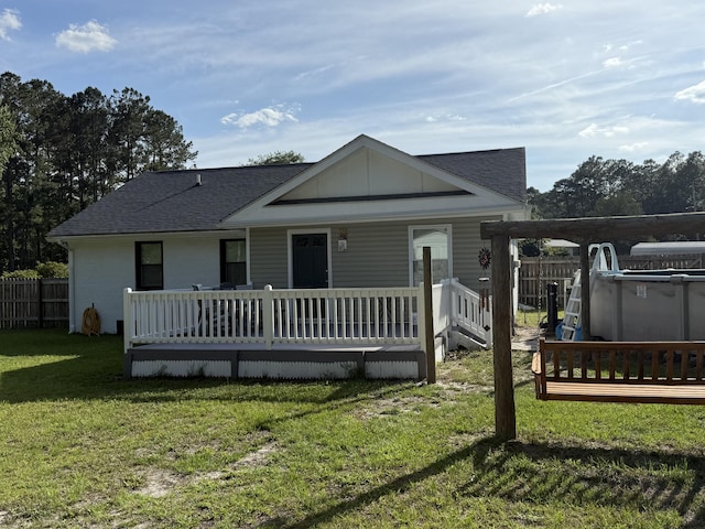 304 Carolina Cir, Walterboro, SC 29488 - rear view of house featuring roof with shingles and a porch