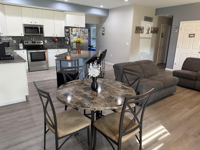 304 Carolina Cir, Walterboro, SC 29488 - dining space with baseboards, light wood-type flooring, and recessed lighting