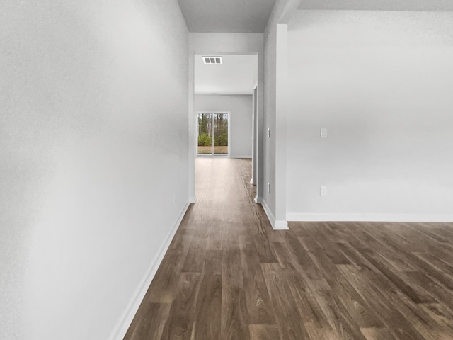 hall with dark hardwood / wood-style flooring