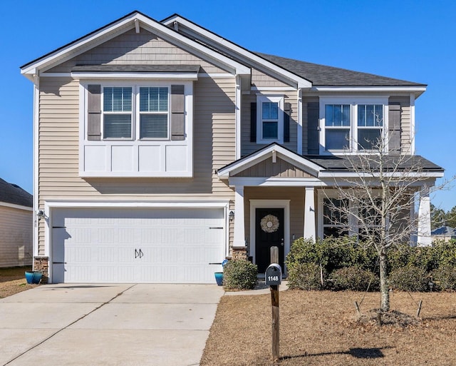 craftsman inspired home featuring driveway and an attached garage