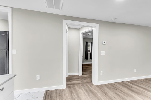 1979 Macon Ave, North Charleston, SC 29405 - empty room with a smoke detector, baseboards, and light wood-style floors