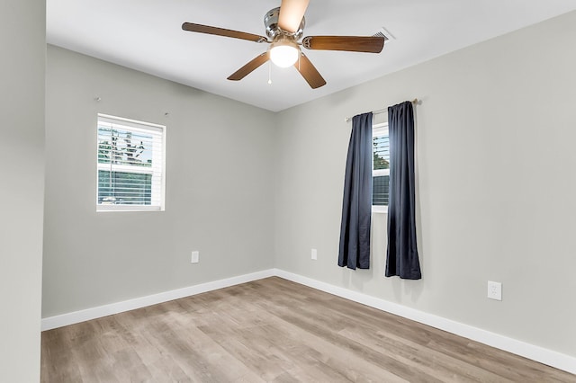 1979 Macon Ave, North Charleston, SC 29405 - empty room with plenty of natural light, wood finished floors, and a ceiling fan