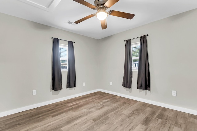 1979 Macon Ave, North Charleston, SC 29405 - empty room featuring healthy amount of natural light, wood finished floors, a ceiling fan, and baseboards