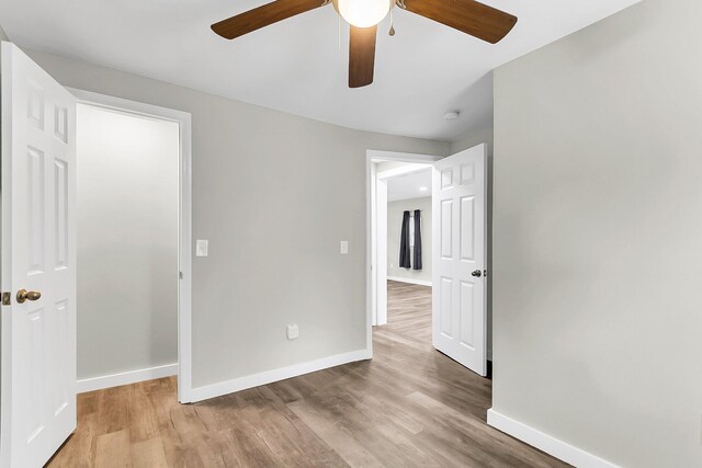 1979 Macon Ave, North Charleston, SC 29405 - unfurnished bedroom featuring wood finished floors, baseboards, and ceiling fan