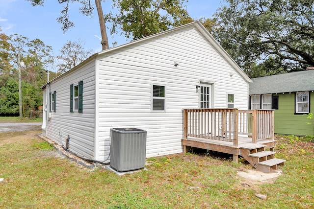 1979 Macon Ave, North Charleston, SC 29405 - rear view of house with central AC, a deck, and a yard