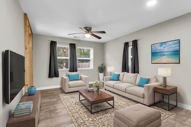 1979 Macon Ave, North Charleston, SC 29405 - living room featuring light wood finished floors, baseboards, and ceiling fan