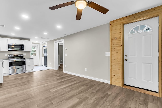 1979 Macon Ave, North Charleston, SC 29405 - unfurnished living room featuring light wood finished floors, recessed lighting, ceiling fan, and baseboards