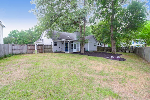 view of yard with a sunroom