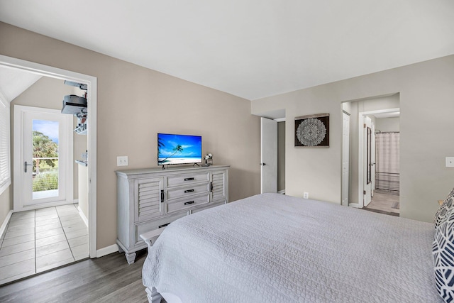 202 Mariners Cay Dr, Folly Beach, SC 29439 - bedroom featuring wood finished floors, access to exterior, and ensuite bathroom