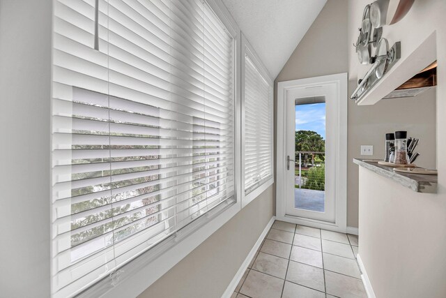 202 Mariners Cay Dr, Folly Beach, SC 29439 - entryway with light tile patterned floors and lofted ceiling