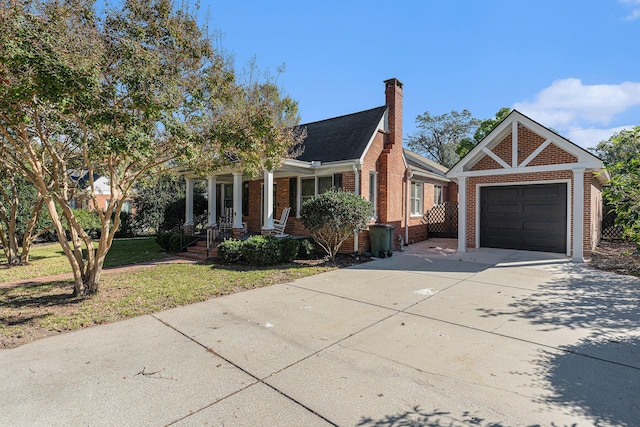 view of front of house featuring a garage and a front lawn