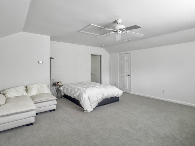 carpeted bedroom featuring attic access, visible vents, baseboards, ceiling fan, and vaulted ceiling