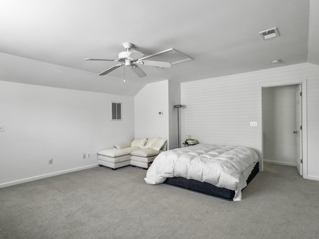 bedroom with lofted ceiling, carpet floors, and visible vents