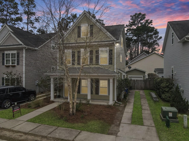 view of front of house with fence