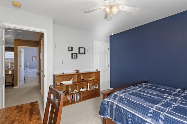 bedroom with ceiling fan and carpet