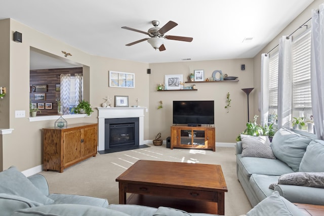 living room with light carpet and ceiling fan