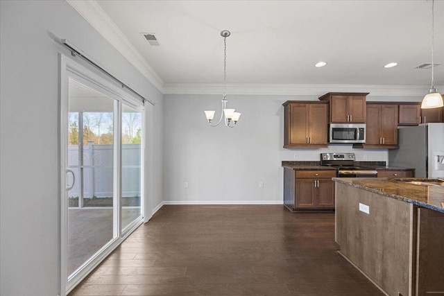 kitchen featuring decorative light fixtures, dark hardwood / wood-style flooring, stainless steel appliances, ornamental molding, and a notable chandelier