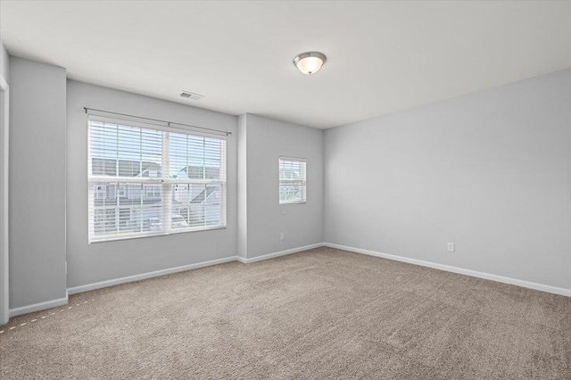 empty room featuring carpet flooring