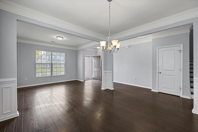 interior space with dark hardwood / wood-style floors, crown molding, and a notable chandelier