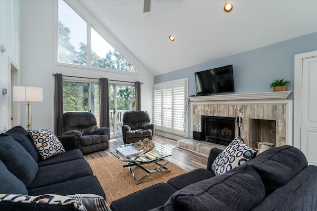 living room with high vaulted ceiling and hardwood / wood-style flooring