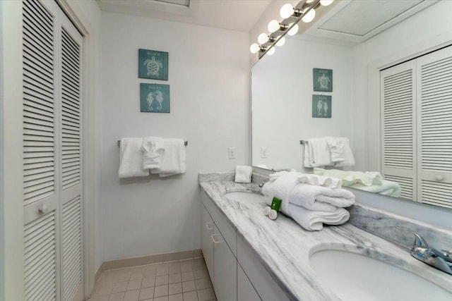 bathroom featuring tile patterned flooring and vanity