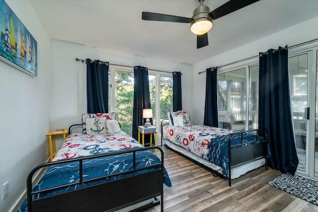 bedroom featuring ceiling fan and hardwood / wood-style flooring