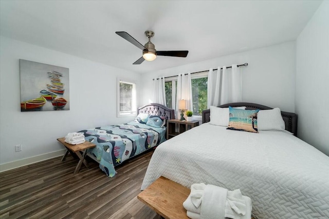 bedroom featuring ceiling fan and dark hardwood / wood-style floors