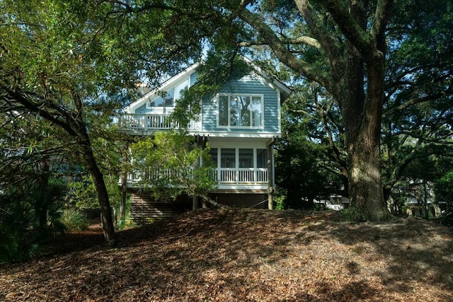 view of side of property with a sunroom