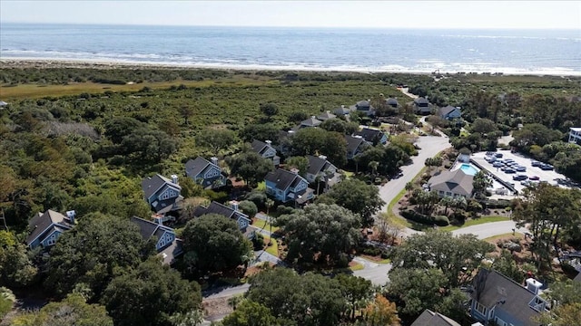 drone / aerial view featuring a water view and a beach view