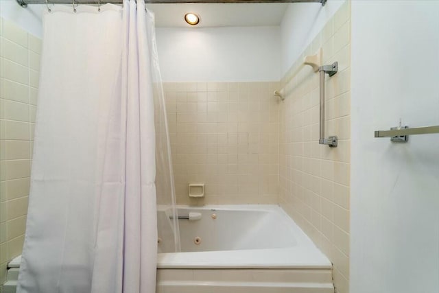 bathroom with shower / tub combo with curtain