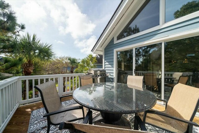 wooden deck featuring grilling area