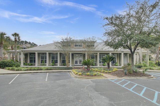 view of property with uncovered parking